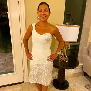 Elegant dress has beaded silver details and is one shoulder